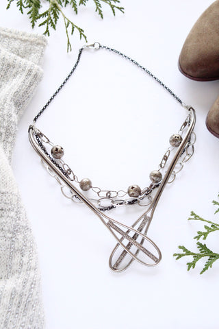 bold layered silver necklace snowshoe inspired vintage cool designer in toronto