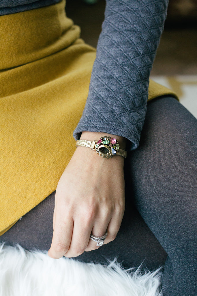 woman wearing a vintage inspired bracelet with colourful jewels