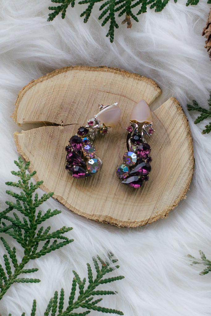 vintage purple rhinestone earrings on wood with greenery holiday handmade in toronto 