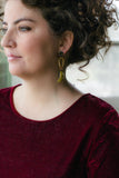mustard yellow statement earrings on girl with velvet dress and curly hair handmade in toronto